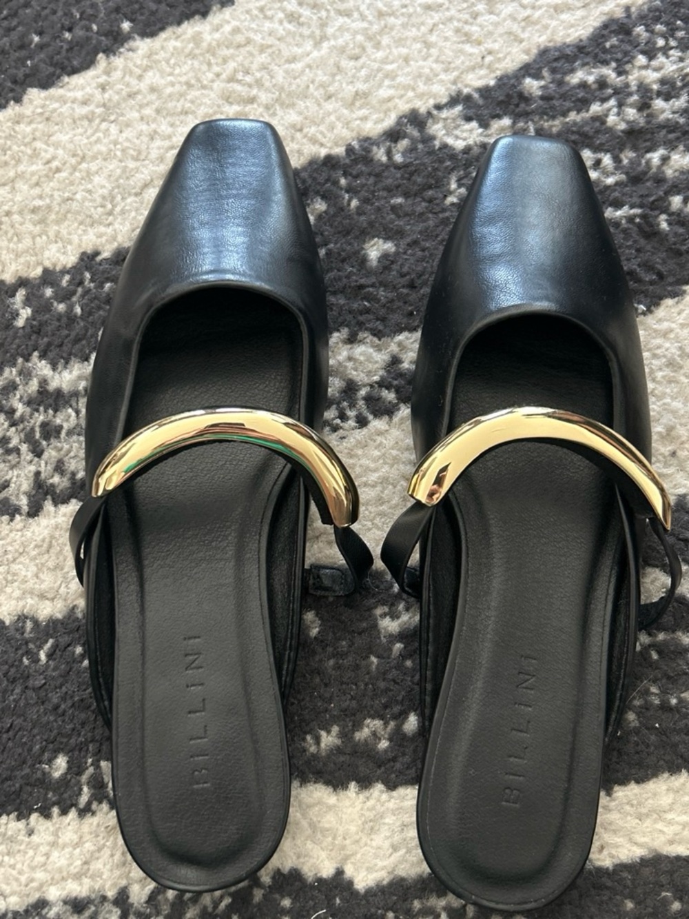 Billini Black Leather Slip-On Flats with Gold Curl Accent